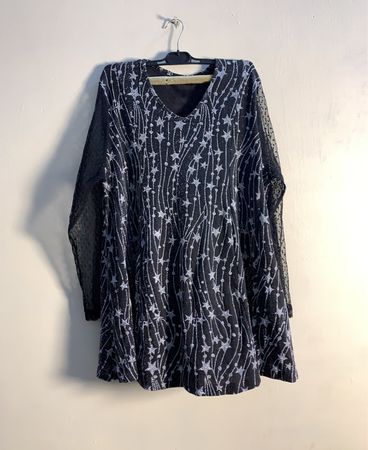 Black dress with star pattern and sheer sleeves