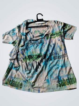 White T-shirt with blue and green abstract print and text