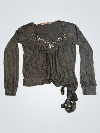 Black long-sleeve top with embellished neckline and tie detail