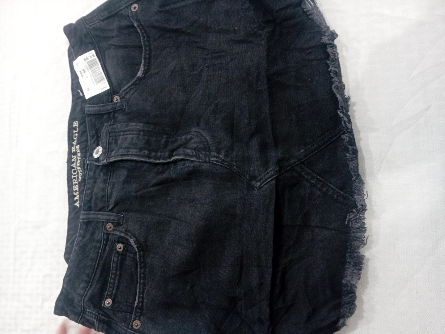 Jupe en denim noir American Eagle avec ourlet effi..