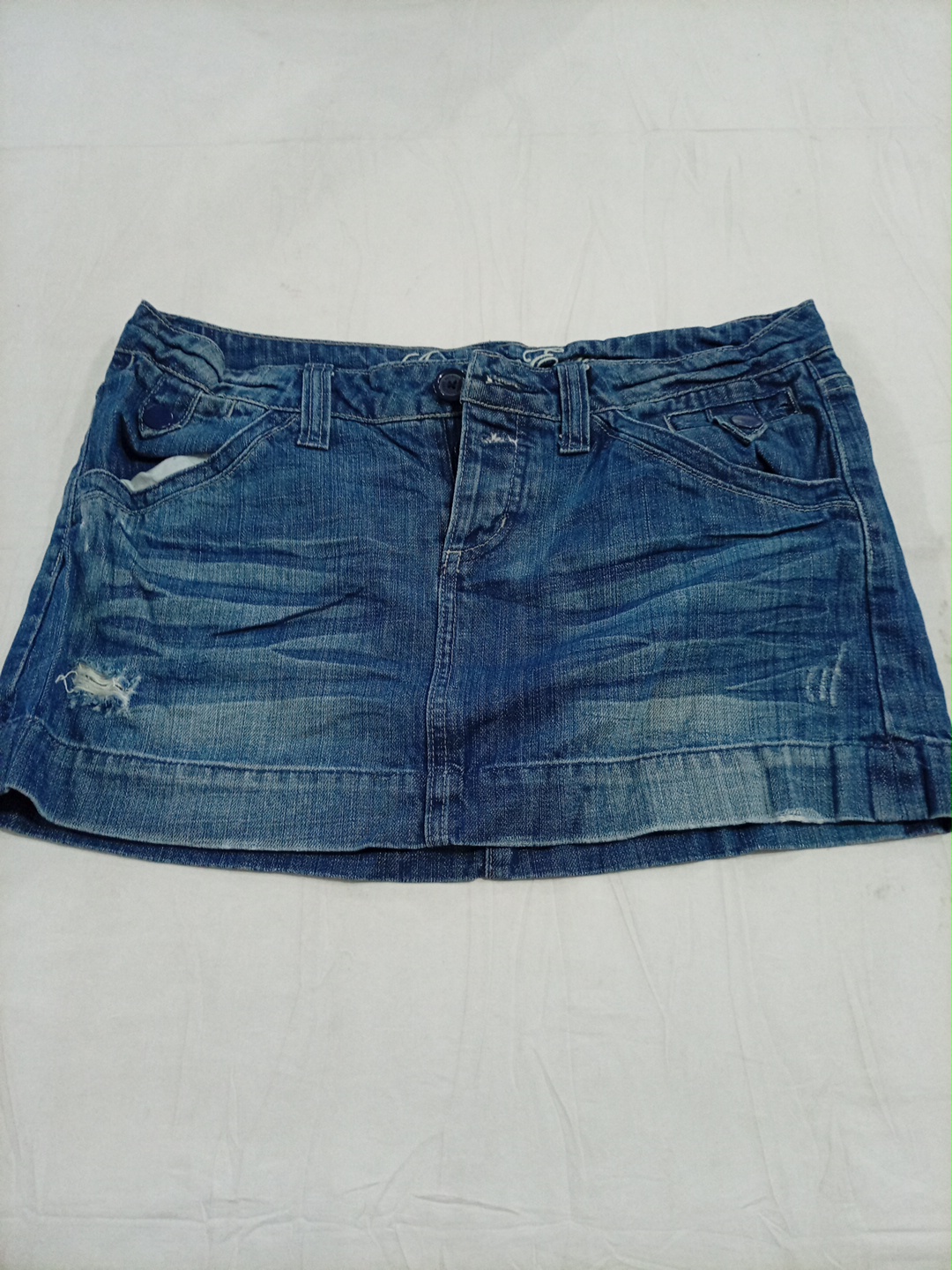 Jupe en denim déchirée mini taille basse American ..