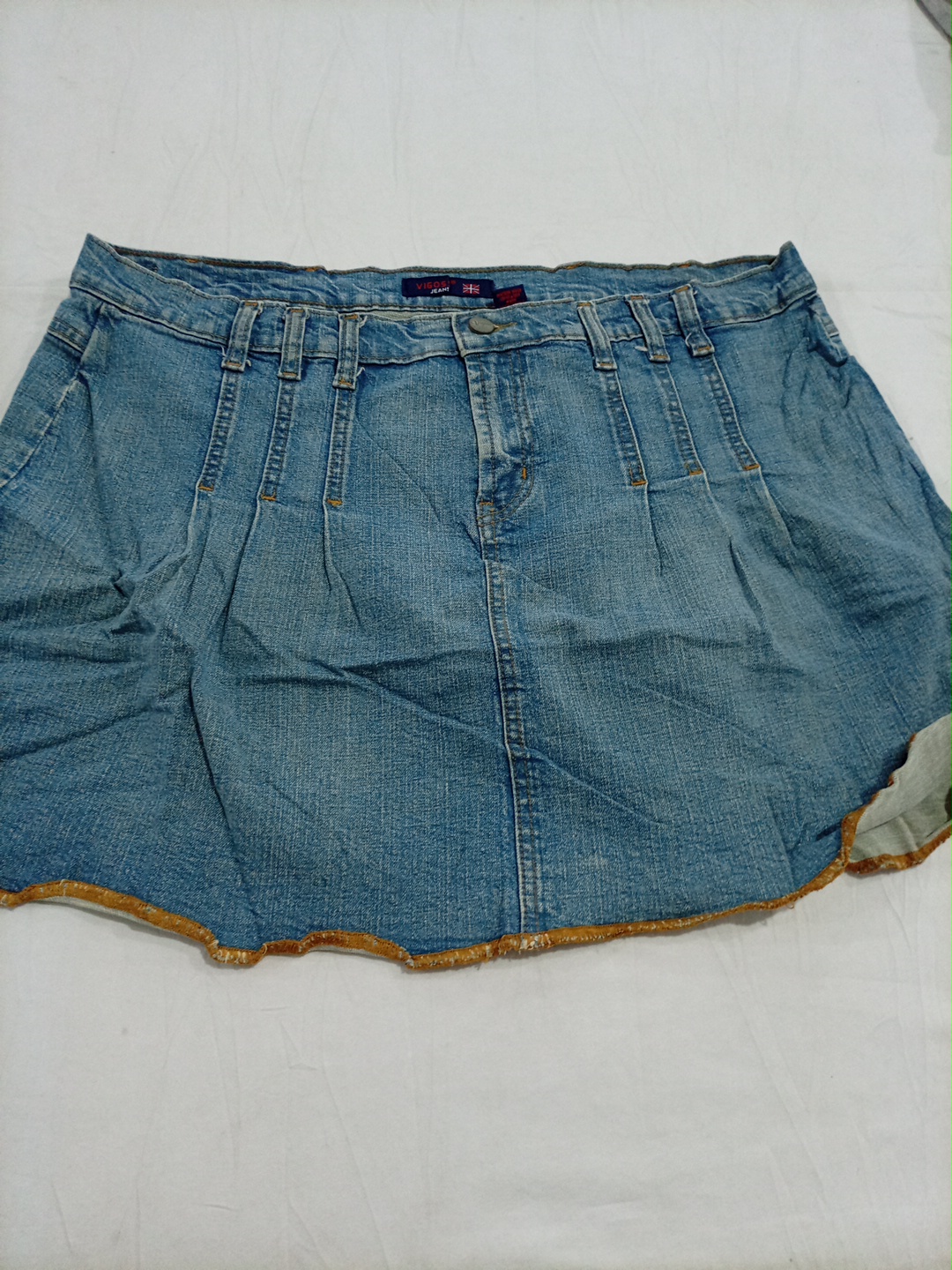 Jupe mini plissée en denim bleu Vigosos