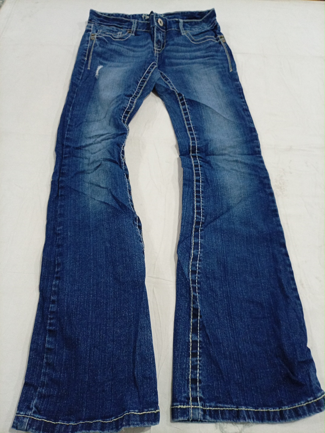 Amethyst Distressed Low-Rise Bootcut Jeans in Medi..