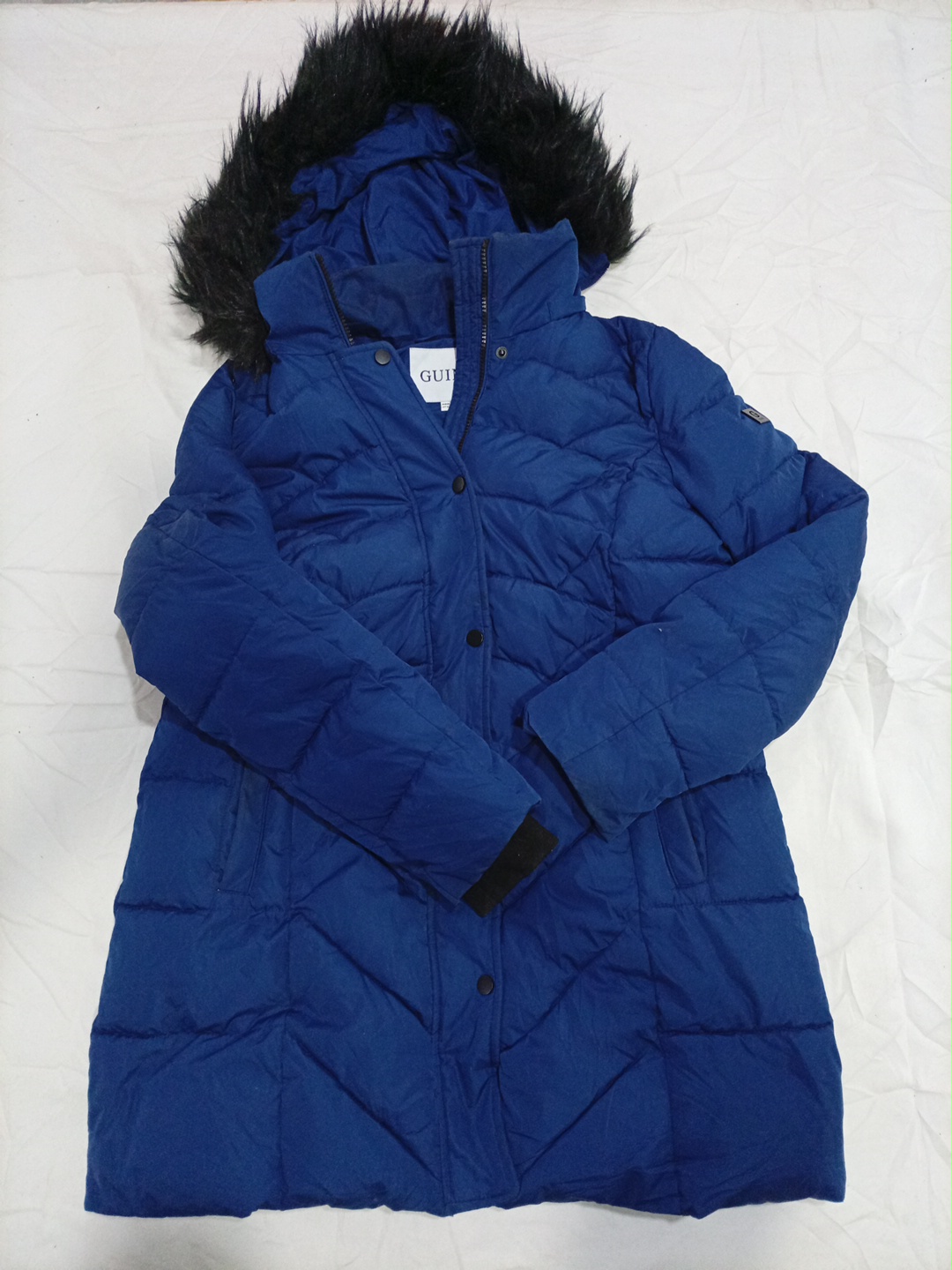 Veste matelassée bleue Guess avec capuch..