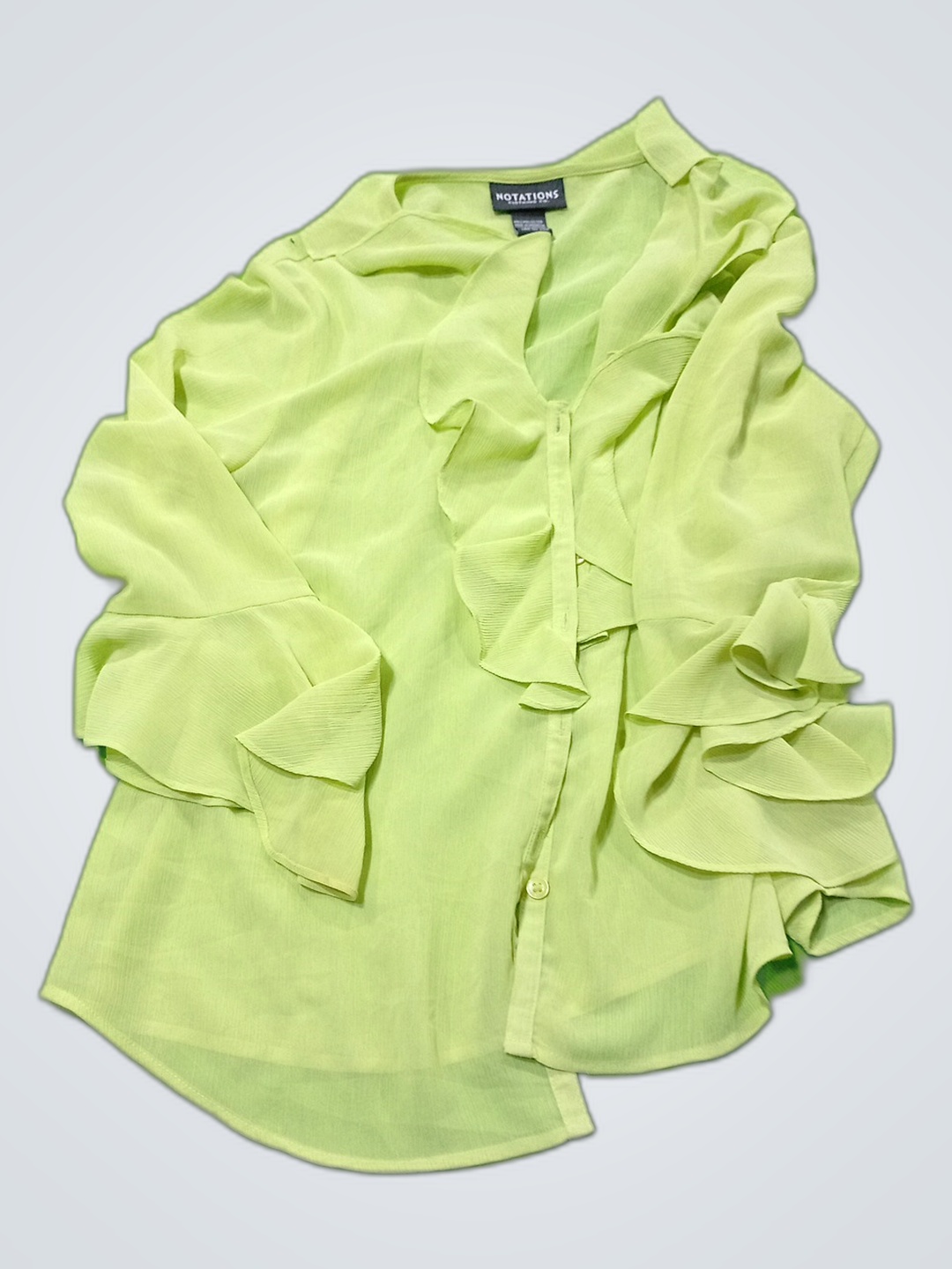 Blusa con volantes Notations