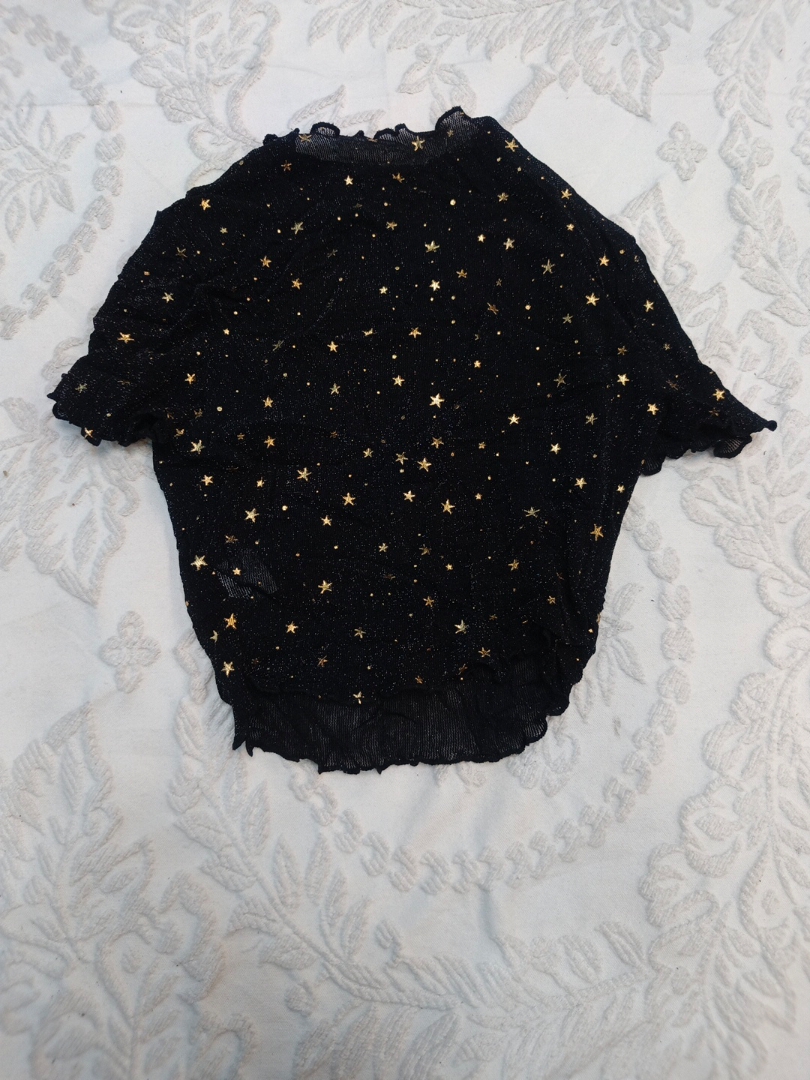 Top in rete con stampa a stelle nere