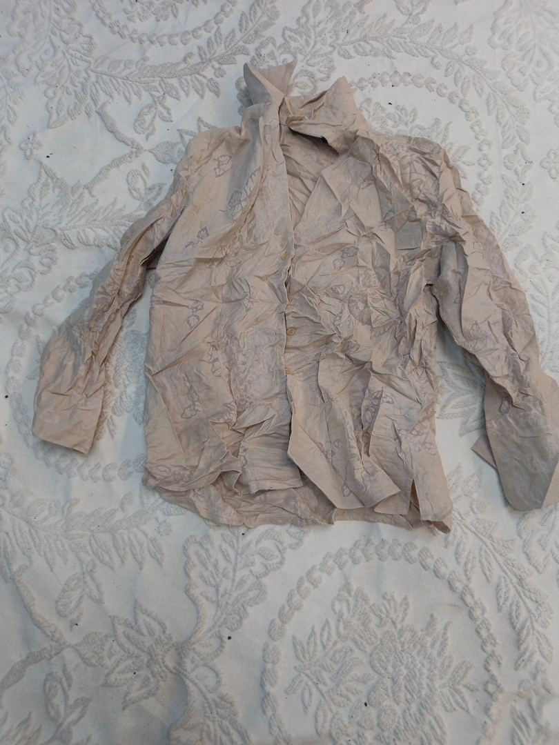 Long-sleeved beige shirt with floral pattern