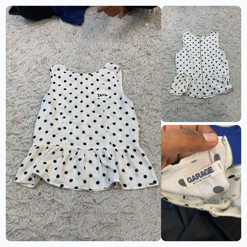 Top sans manches à pois blancs Garage