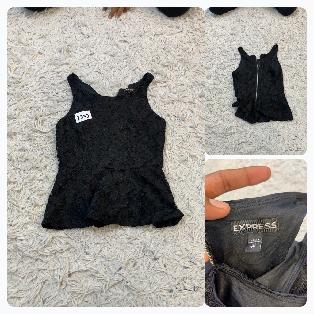 Top sin mangas peplum de encaje negro Express