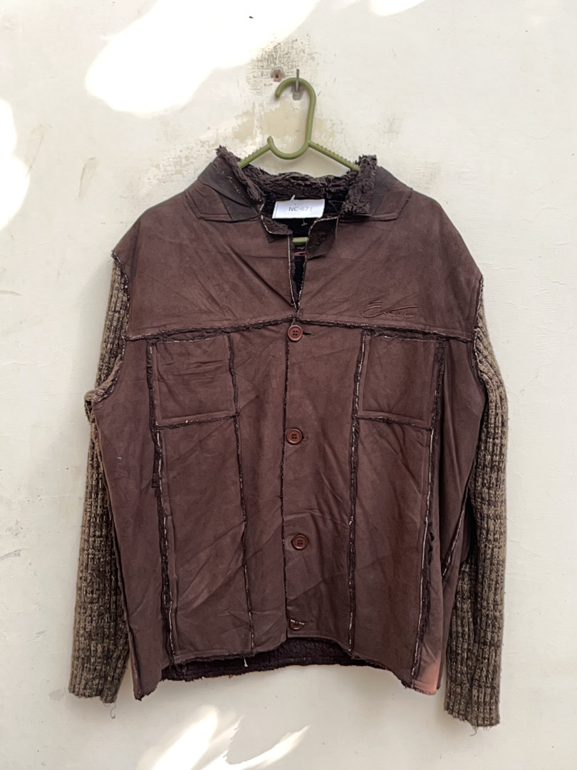 Vintage Distressed Leather Jacket with Knit Sleeve..