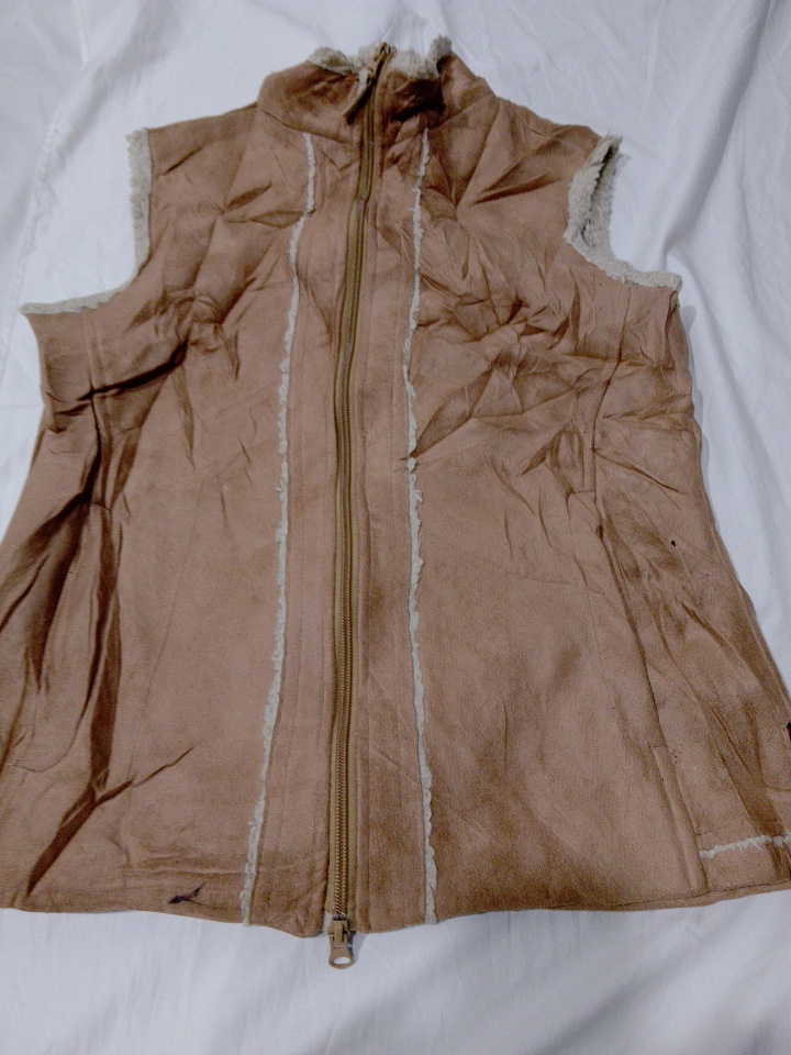 Veste sans manches en peau de mouton pour femmes W..