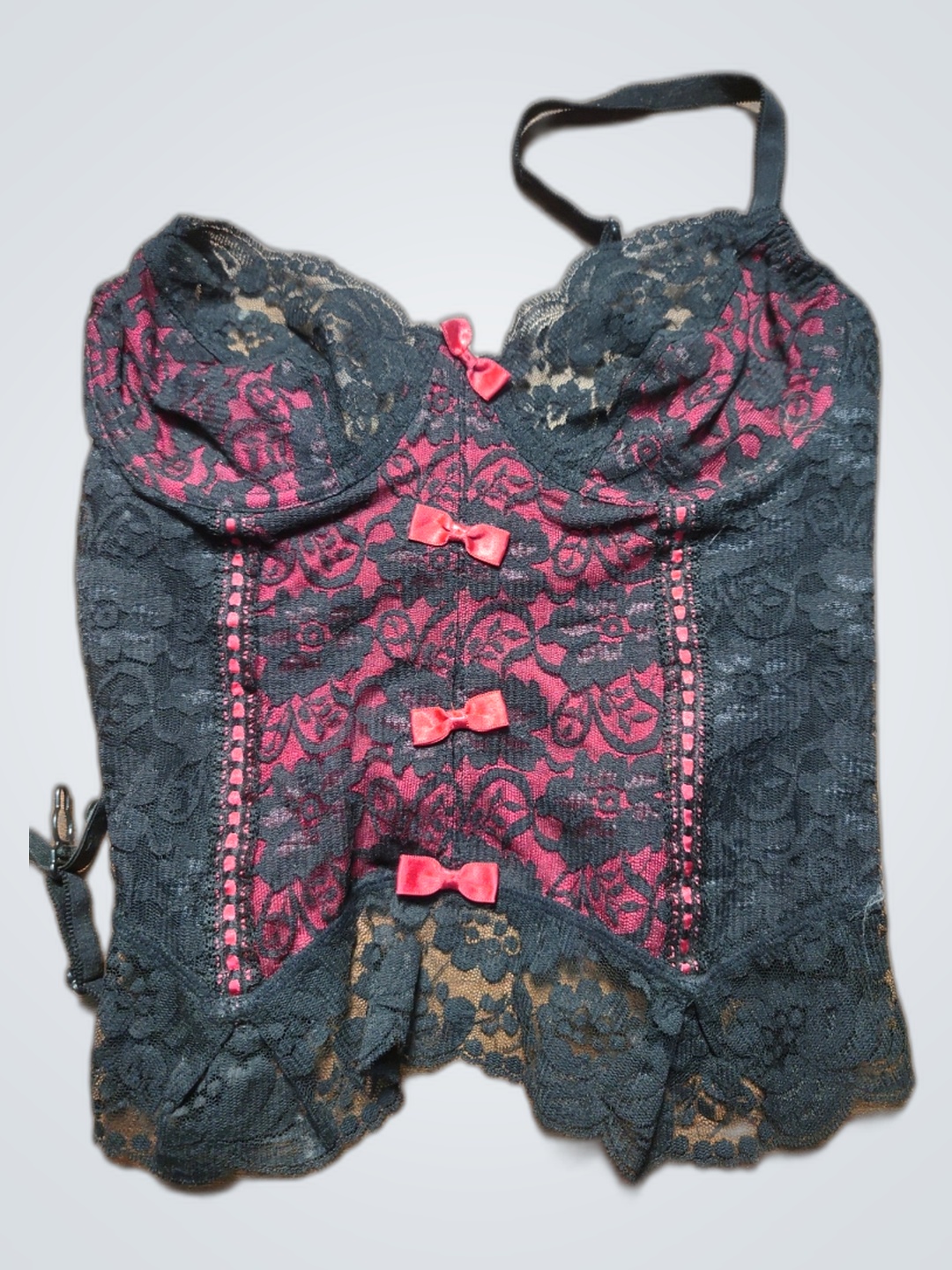 Corsetto in pizzo nero con fiocchi rosa