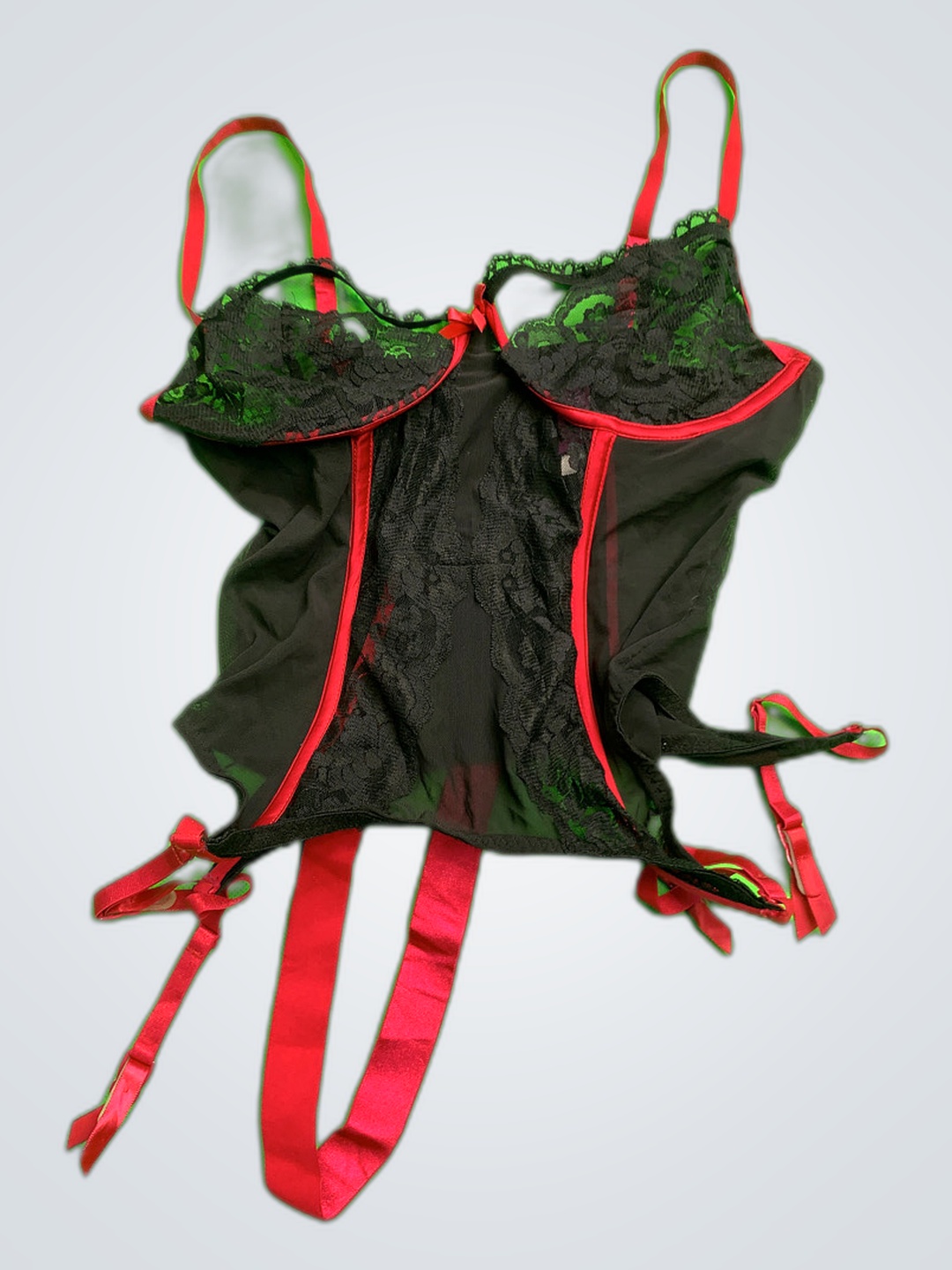 Schwarzes Spitzenkorsett mit roten Bändern