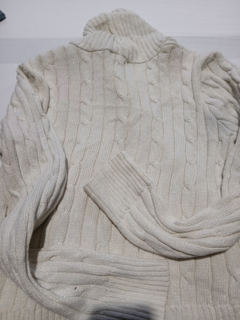Cream-colored knitted sweater